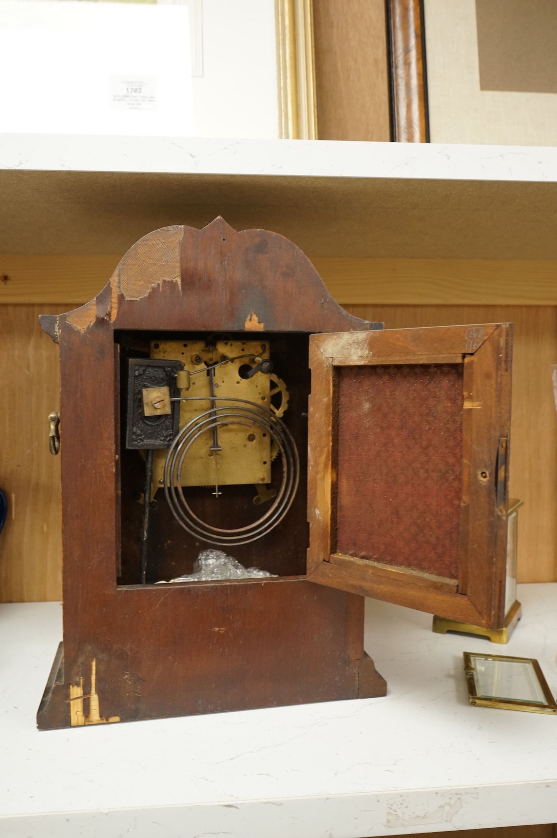 An early 20th century inlaid mantel clock with key and pendulum and a brass cased carriage timepiece, largest 32cm high